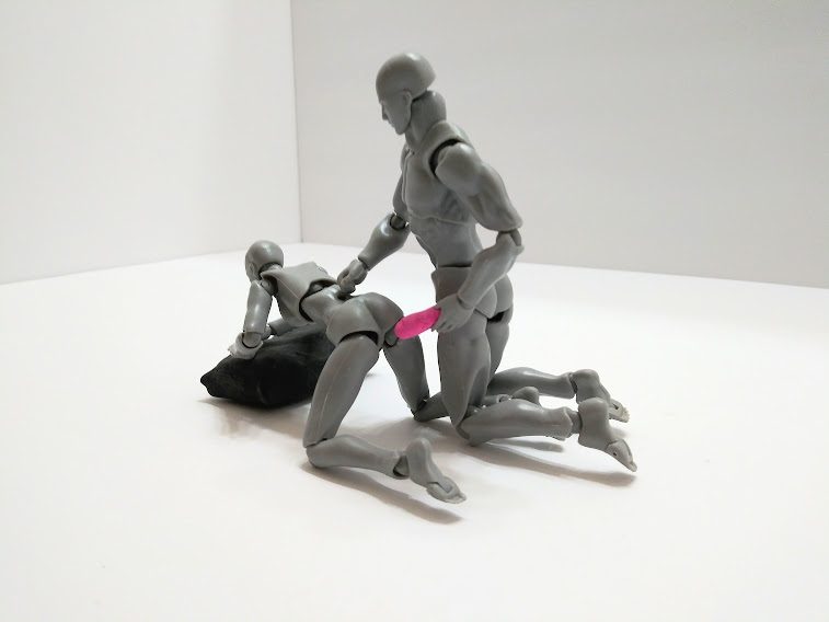 How to use a vibrator on your wife. Photo of poseable figures on the doggy style position with him using a vibrator on her.