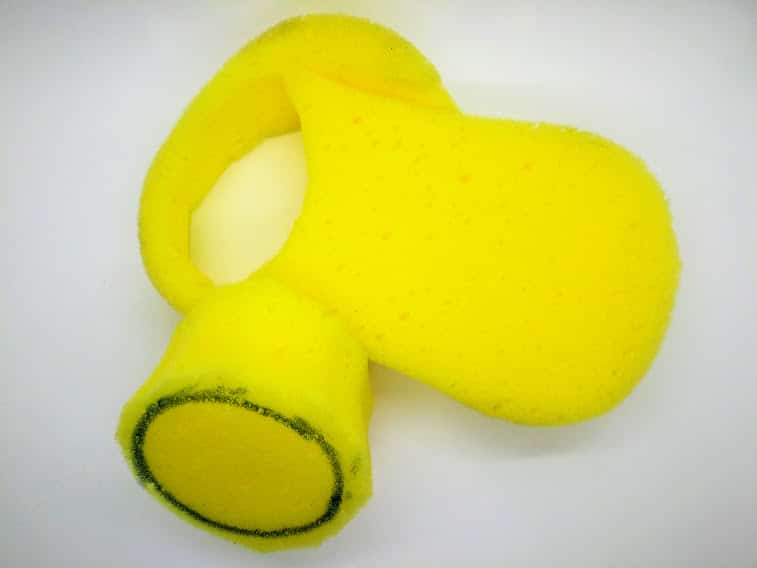 How to make a DIY penis pump; photo of step 6 showing the circle of sponge after being cut out.