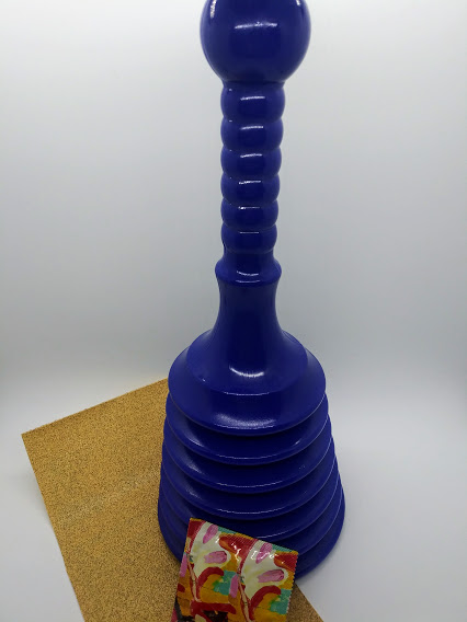 DIY anal sex toy from an accordion plunger, photo of a blue accordion plunger, sand paper and a condom.