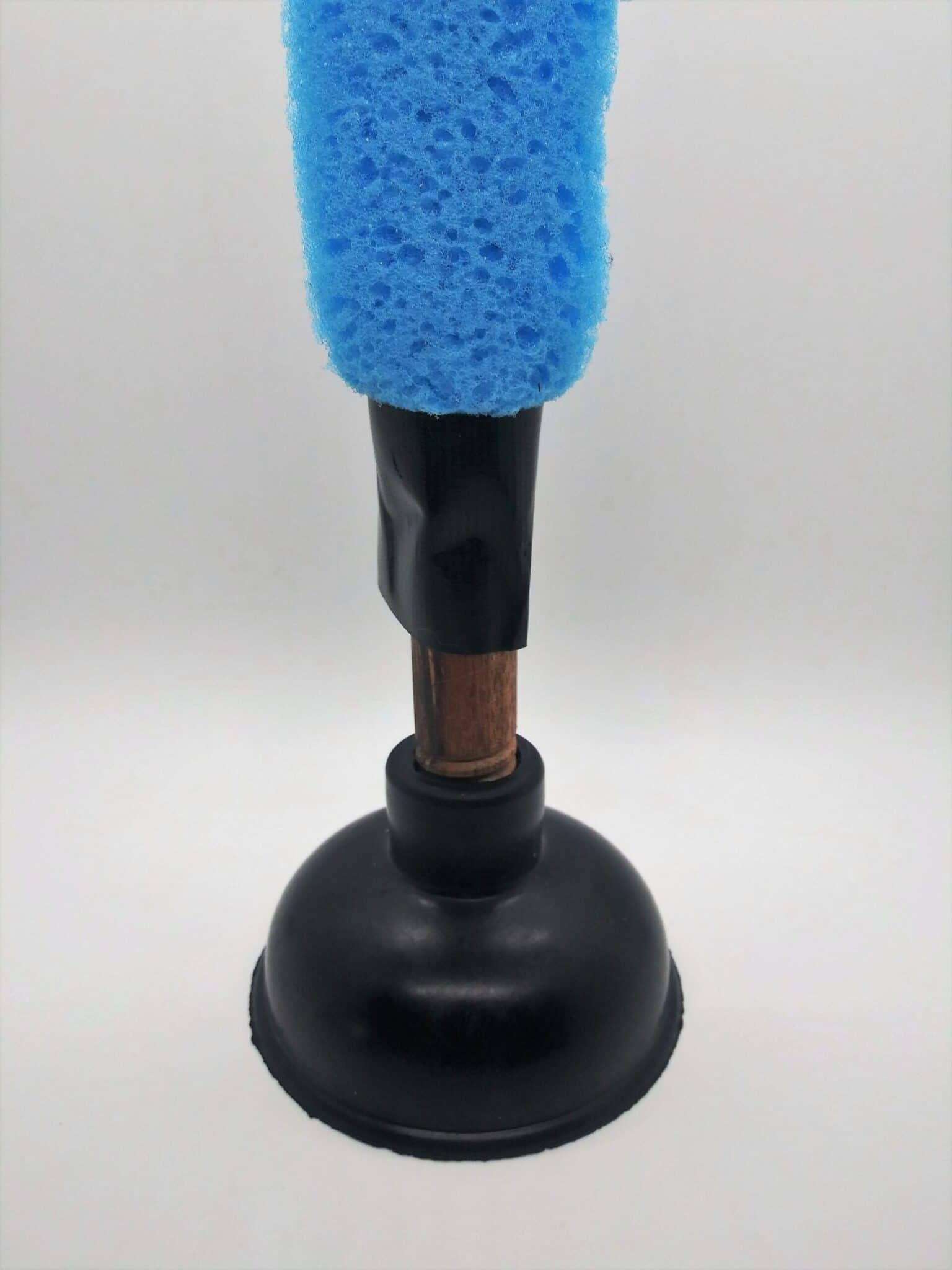 DIY anal sex toys using a plunger. Photo of a sponge covering a plunger handle and secured at the bottom using duct tape.