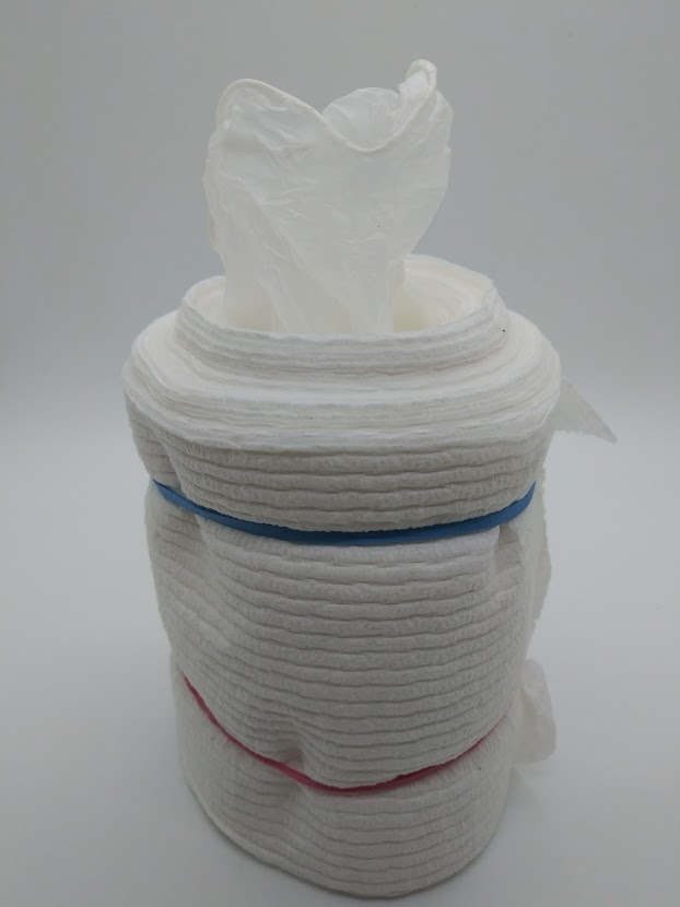Toilet paper DIY pocket pussy. Next step showing how to place a medical glove into the center