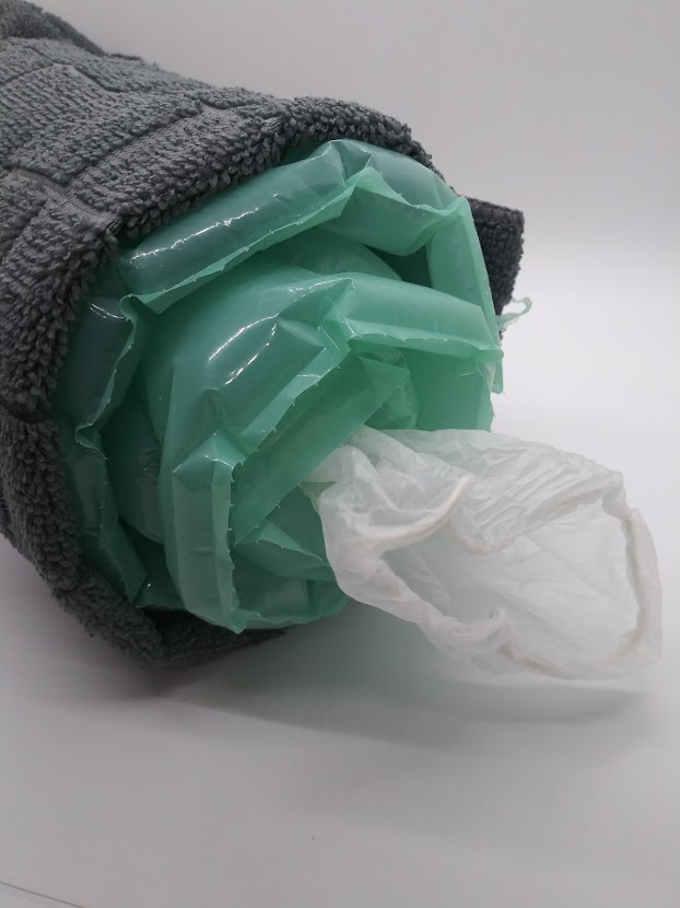 DIY bubble wrap pocket pussy. Showing how to place a medical glove inside one end of the bubble wrap roll.