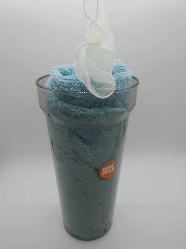 DIY Fleshlight candy cup. Showing the rolled towel inside the sports cup.