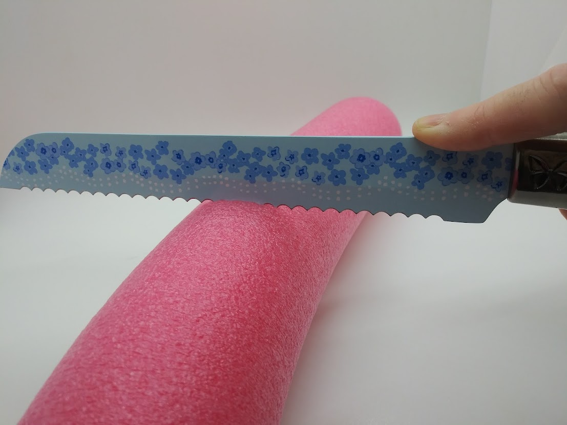DIY Fleshlight Canoodler using a pool noodle. Showing how to cut the pool noodle with a knife.