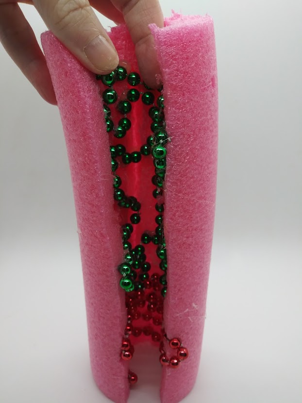 DIY Fleshlight using a pool noodle. Showing how the interior of the tube appears after all of the beads are applied.