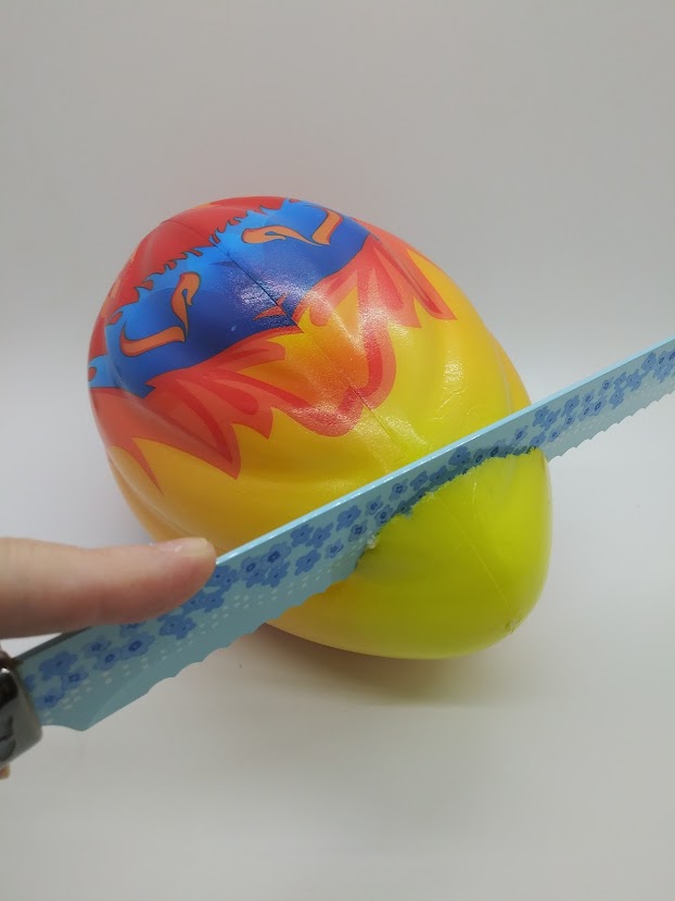 DIY pocket pussy Nerf football. Showing how to cut the end from the football.