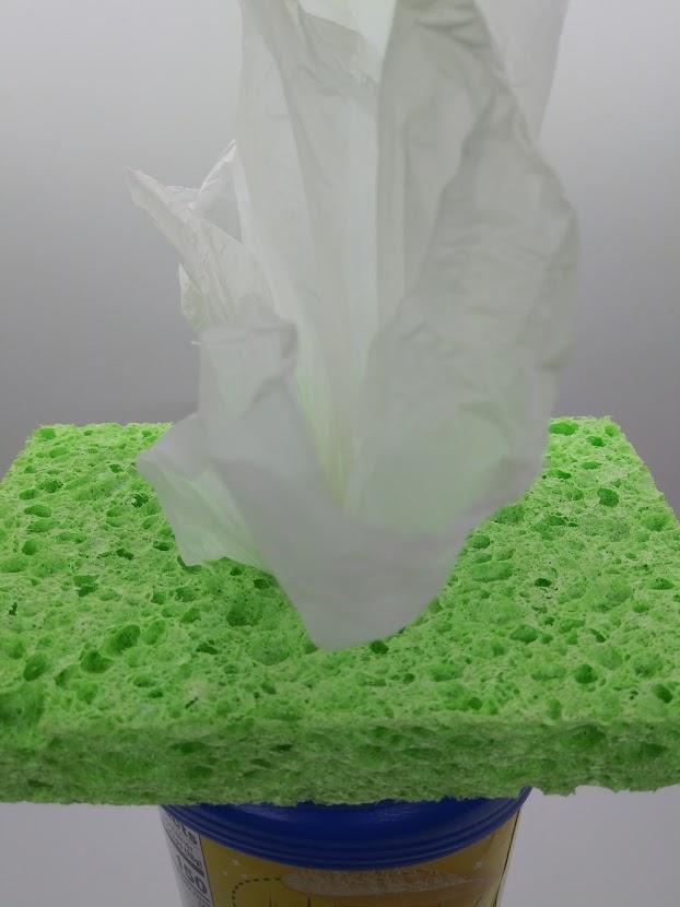 Squirter DIY Fleshlight showing how to pull the plastic bag through the sponge.