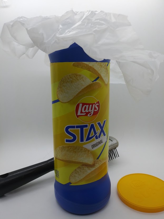 Squirter DIY Fleshlight showing how to place the bag inside the chip can