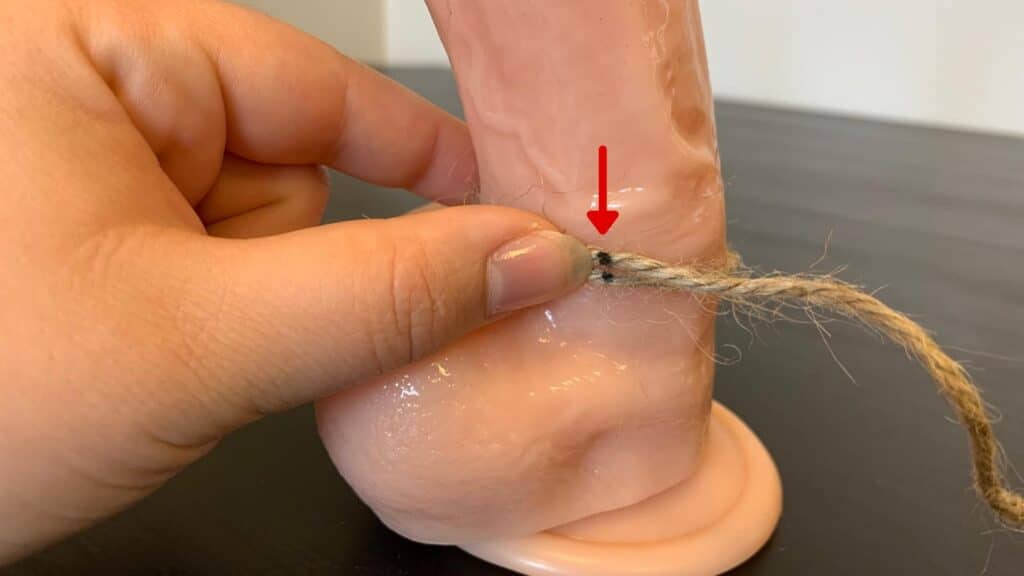 Wrap a string around your penis and mark where the two sides meet