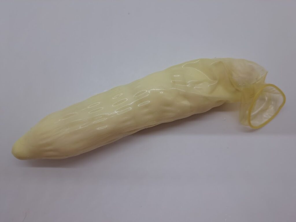 Stuffed condom dildo