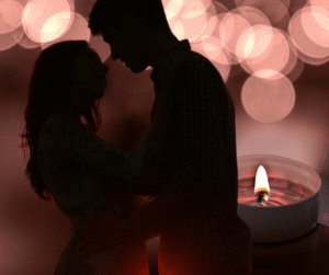 Stimulating her mind, heart and soul before oral sex, silhouette of couple and candlelight 