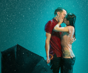 Kissing will make her wet, photo of couple kissing in the rain