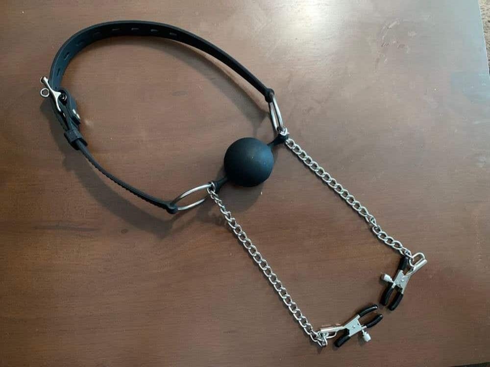 DOMINIX Deluxe Large Breathable Ball Gag with Nipple Clamps. Slide 3