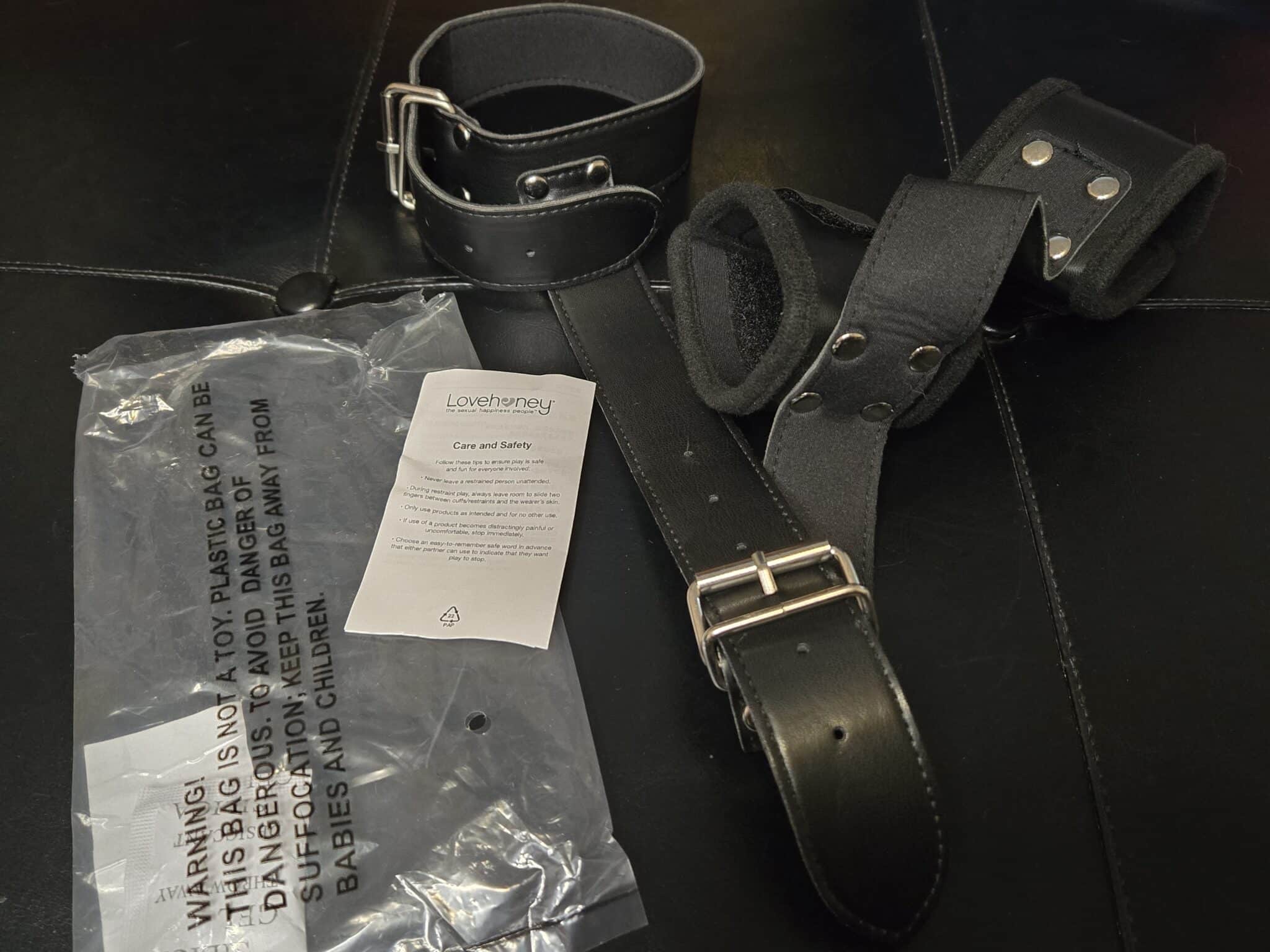 Bondage Boutique Faux Leather Collar to Wrist Restraints Packaging